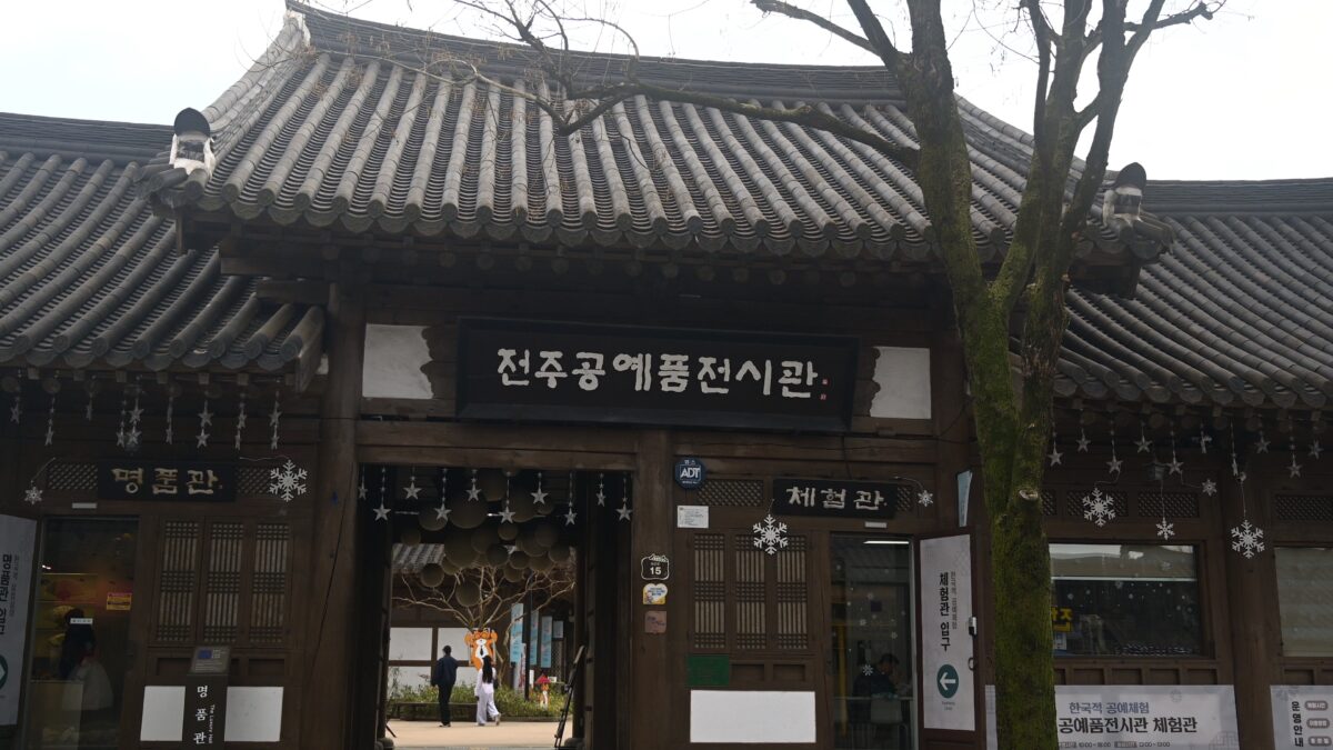 Crowded street in Jeonju Hanok Village filled with tourists and traditional hanok buildings
