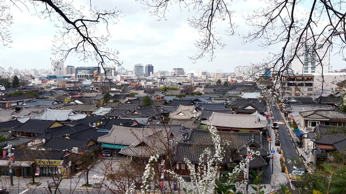 Narrow alley in Jeonju Hanok Village with tiled roofs and quiet traditional houses