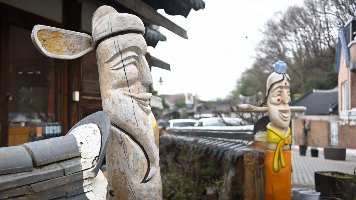 Narrow alley in Jeonju Hanok Village with tiled roofs and quiet traditional houses
